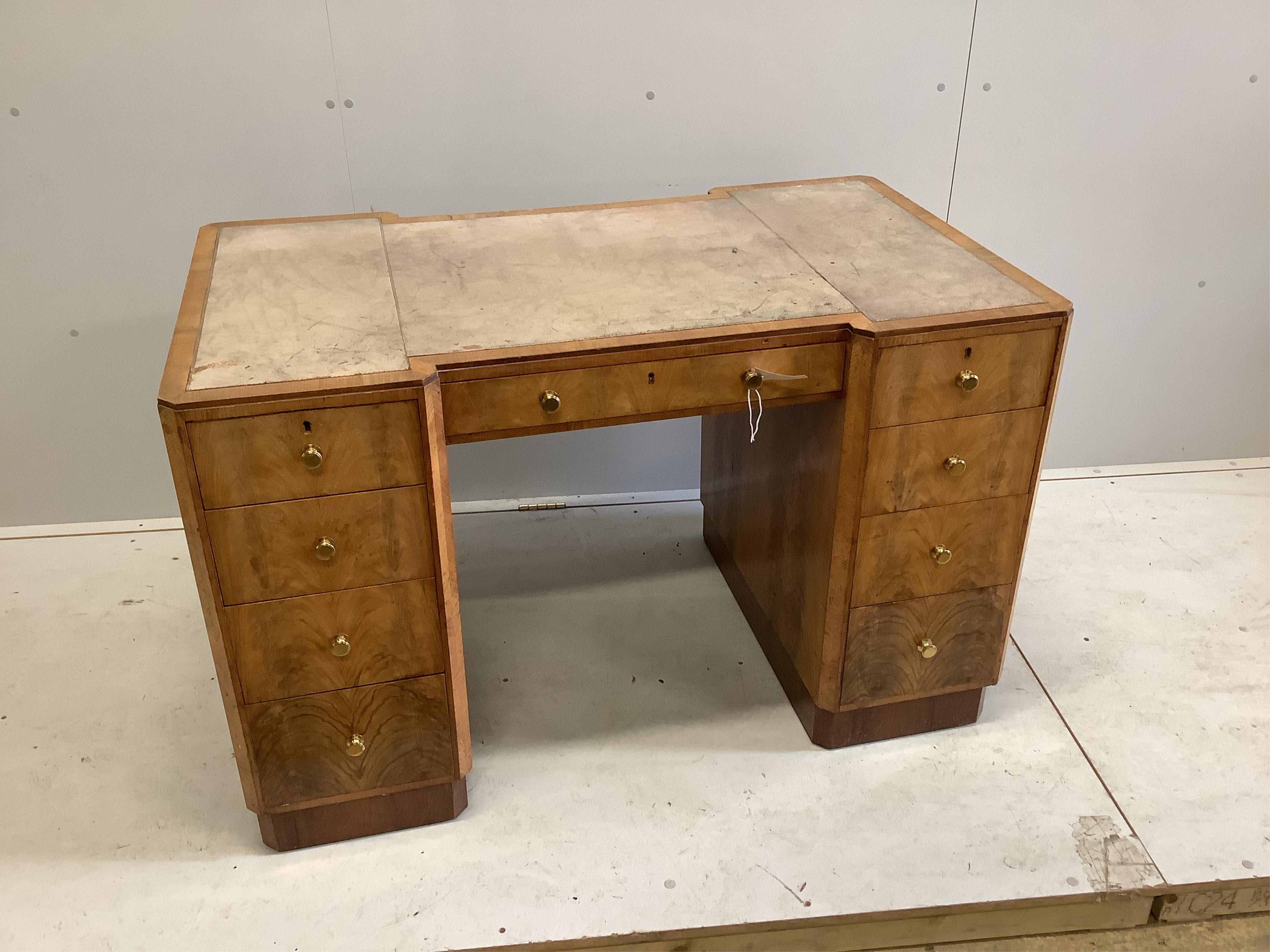 An Art Deco maplewood desk, width 122cm, depth 72cm, height 76cm. Condition - fair